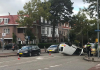 Auto op zijn kop bij aanrijding Fotografie: Bart van Leuven.